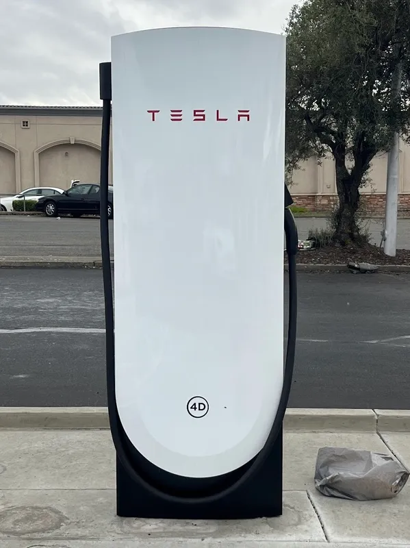 A Tesla at a Supercharger