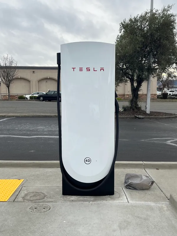 A Tesla at a Supercharger